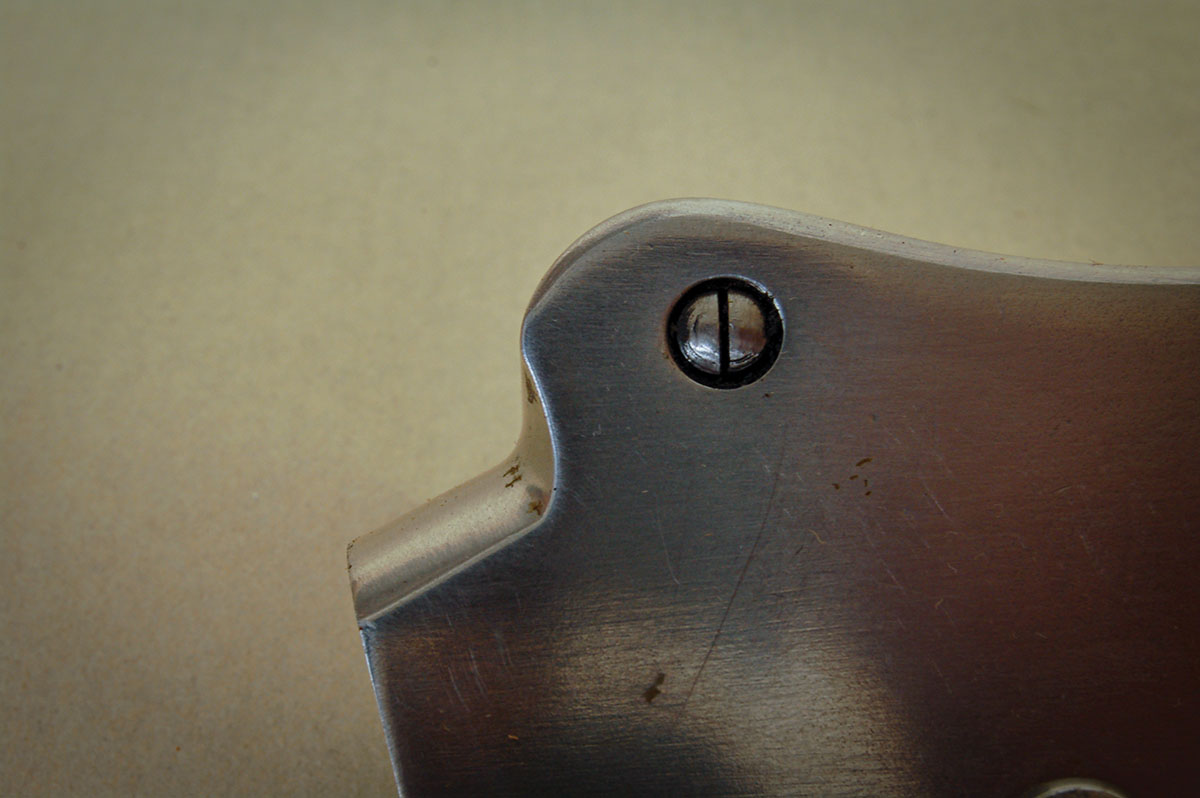 Annoying Martini split-pin. What appears to be a screw slot is not.